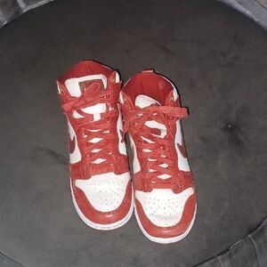 Nike Dunk Red and White High-Top Sneakers.